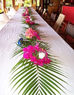 a long table with flowers and candles on it is shown in an instagramr