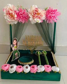 there is a green box with pink and white flowers on it that says vajhanan mehandi