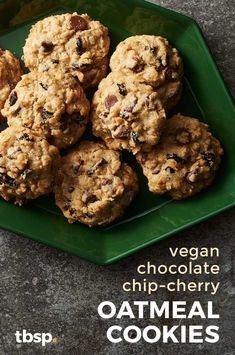 a green plate filled with cookies on top of a table