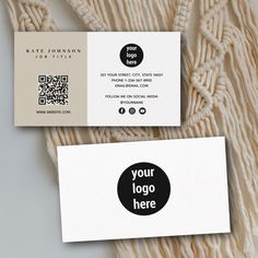 two business cards on top of each other with a black and white circle in the middle