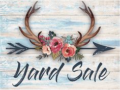 a sign that says yard sale with antlers and flowers on the front of it