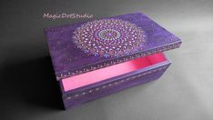 a purple box with an intricate design on the lid