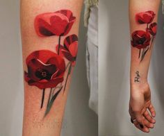 two pictures of red flowers on the left forearm and right arm, both with black ink