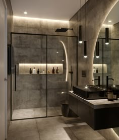 a bathroom with two sinks and a large mirror in the wall next to each other