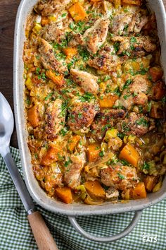 a casserole dish with chicken and vegetables