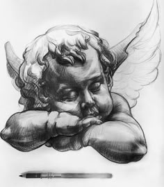 a pencil drawing of an angel with its head resting on his hands next to a pen