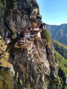 a mountain with some buildings on top of it