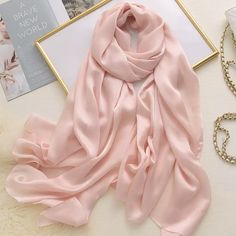 Wrap yourself in the essence of sophistication with our Silken Embrace Scarves. Each piece is a celebration of elegance, crafted to offer the luxurious touch of silk with the practicality of modern fabrics. The oblong design ensures versatility in styling, whether draped elegantly over the shoulders or tied in a chic knot, making it the perfect companion for both casual and formal ensembles. Our scarves, available in a medley of enchanting hues and patterns, are designed to complement every outf Chandon Rose, Satin Shawl, Pashmina Wrap, Winter Typ, Drape Maxi Dress, Hijab Scarf, Beige Light, Midi Dress Casual, Chiffon Scarf