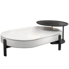 a white and black coffee table with two tables on each side