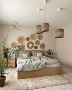 a bedroom with lots of wicker baskets hanging above the bed