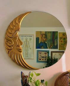 a mirror that is on the wall above a table