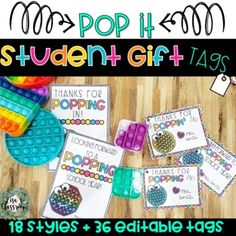 the back to school pop it student gift tags are on display in front of a wooden table