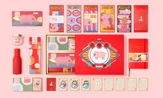 an assortment of stationery items including notebooks, cards and pens on a pink background