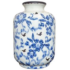 a blue and white vase with floral designs on it's sides, isolated against a white background