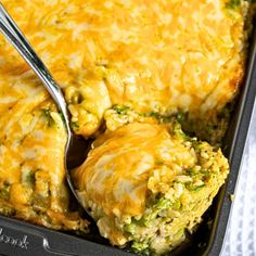 a casserole dish with broccoli, cheese and chicken in it is ready to be eaten