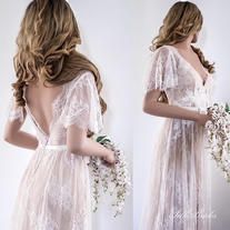 the back of a woman's dress with flowers on it