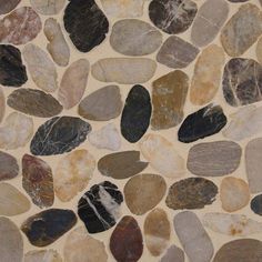 a stone floor with different colored rocks on it