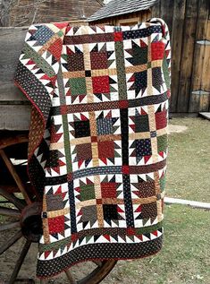 a quilt is shown with the words, nollie's needle quilt patterns on it