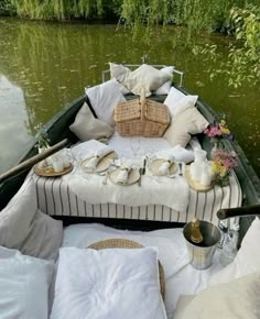 a boat filled with lots of pillows and plates on top of it's side