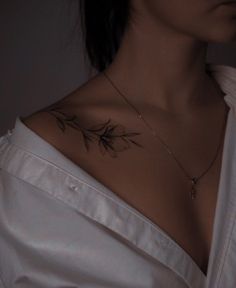 a woman with a tattoo on her chest