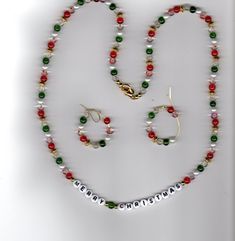 Only 1 available  Handmade item Color(s): Red, green & white Materials: Glass pearl beads & crackle glass beads Spacers: Gold colored Strands: 1 Each strand is "double-wired" for added strength Necklaces are made to just put over your head with ease Finished off with a lobster clasp Matching pierced earrings: drop or hoop Matching bracelets available upon request Shipped: from Henderson, NV Priority Mail - 2 day delivery with tracking code * IMPORTANT NOTE * Please let me know if there's somethi Christmas Necklace Beads, Holiday Gold Beaded Necklace, Green Round Bead Jewelry For Holidays, Christmas Necklaces With Colorful Beads, Red Christmas Jewelry With Colorful Beads, Christmas Bead Necklace, Festive Red Multi-strand Beaded Necklace, Christmas Necklace, Christmas Bead