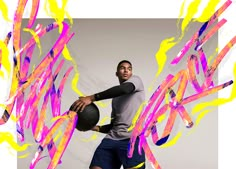 a man holding a basketball while standing in front of an abstract background with neon colors