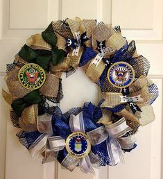 a wreath made out of burlocks and ribbons with the seal of the united states on it