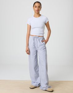 This cotton pant features a relaxed leg style, an adjustable tie waist and pockets. Blue And White Striped Pants, Blue Linen Pants, Knitwear Dress, Cotton Pants, Striped Pants, Swimwear Accessories, Linen Pants, Jeans Dress, Mist