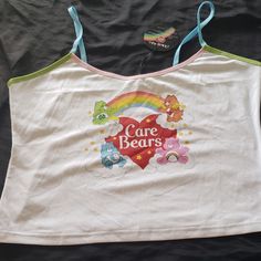 Dolls Kill X Care Bears 2x Tank Top Brand New With Tags. Cute Multicolor Cotton Tank Top, Retro White Tops For Playtime, Cute Graphic Print Tank Top, Kawaii Cotton Tops For Playtime, Cotton Kawaii Tops For Playtime, Cute White Tank Top, Carebears Clothes, Care Bear T Shirt, Care Bear Sweater