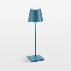 a blue lamp on a white surface with a light shade in the middle and bottom