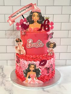 a birthday cake with barbie dolls on it