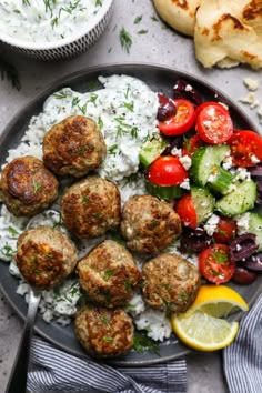 meatballs, rice and vegetables on a plate