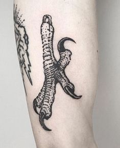 a tattoo on the leg of a person with an eagle and lightning bolt in it