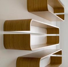 three bookshelves are arranged on the wall