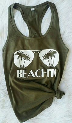 Beachin Womens Tank / Summer Shirt / Tropical Tank / Shirt for the Beach / Beach Shirt / Vacation Shirt / Cruise shirt / Bachelorette Shirt Description - Muscle Tank * 3.7 oz., 65% poly/35% viscose (unless otherwise noted) * 30 single * Relaxed, drapey fit * Low cut armhole * Curved bottom hem * Side-seamed Athletic Heather: * 52% poly/48% viscose Looks Hippie, Beach Tanks Tops, Cruise Shirts, Beach Tanks, V Neck Shirts, Cricut Shirts, Diy Shirts, Shirts To Make, Cruise Shirt