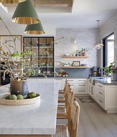 the kitchen is clean and ready to be used for dinner or breakfast time, as well as flowers