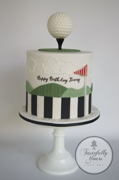 a birthday cake with a golf ball on top