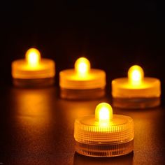 several lit candles sitting on top of a table