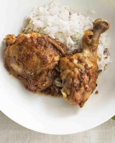 a white bowl filled with rice and meat