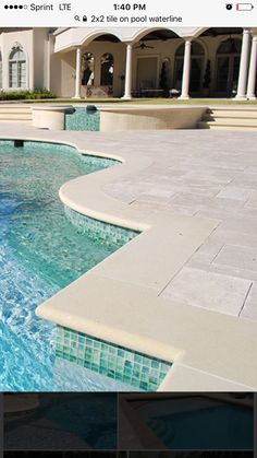 an image of a swimming pool in the middle of a house with steps leading up to it