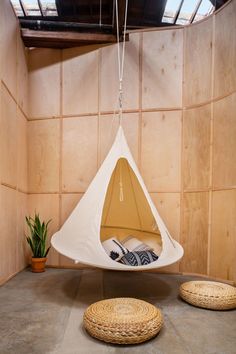 a hammock hanging from the ceiling in a room