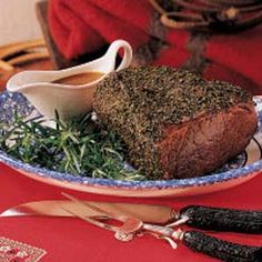 a plate that has some meat on it and other food items in the bowl next to it