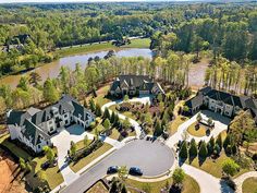 an aerial view of a large home surrounded by trees