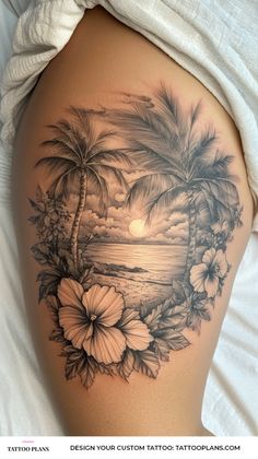 a woman's thigh with flowers and palm trees on the beach in front of it