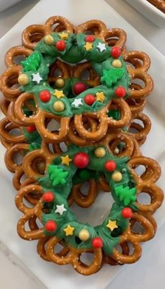 pretzels decorated with christmas decorations on a plate