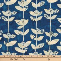 a blue background with white flowers and leaves on it's side, next to a ruler