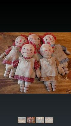 five rag dolls are laying on the floor with their heads turned to look like they're holding hands