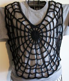 a white shirt with black crochet on it and a gray t - shirt