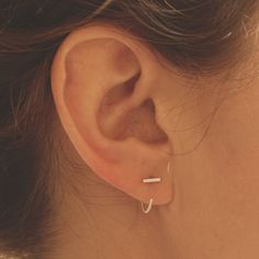 Simple and Modern enough to be worn on a daily basis. These tiny bars are soldered with solid 25mm sterling silver posts. Delicate and minimalist earrings you must have for casual wear or minimalist chic fancy occasions!+ Length - 3mm, 4mm, 5mm, 6mm, 7mm, 8mm, 9mm, 10mm, 11mm+ Material - Sterling Silver + Matte or Polished Finish+ Earring Posts are 20ga Solid Sterling Silver 25mm long+ Packaged in a Kraft Box+ Listing is for a pair+ Model is wearing the 6mm bar length *+*+*+*+*NOTE+_+_+_+_+_+The Hug Earrings, Hammered Hoop Earrings, Sapphire Studs, Chic Earrings, Jewelry Hand, Handmade Fashion Jewelry, Minimalist Chic, Earrings Ear, Emerald Earrings