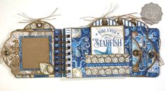 an altered book with blue and white designs